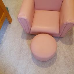 pink chair with foot stool