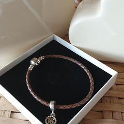 Pandora leather bracelet 19cm comes with a charm either 16th 18th or 21st great condition colour is brown