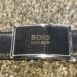 This is a quality designer leather belt by HUGO BOSS. It is Black, is XL size with an adjustable automatic release mechanism just under the buckle giving it quick and easy release of fastening. The rrp was £135