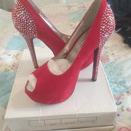 lovely red heels 👠 size 5 never worn lid of box is damaged and 3 gems missing from left shoe as seen in pics but not noticeable :) not as bright red as the pics make them look ....but still red :) if posted will be sent 2nd class signed 👍