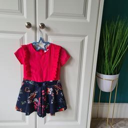 Age 3/4 pink and navy playsuit, top looks very bright or reddish, it's more of a deep pink in real life, lovely bird design, zip fastening at back no damage and very beautiful, starting to show bobbling / wear on the shorts which has been reflected in the price,