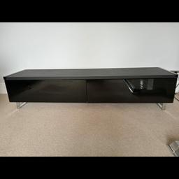Black TV unit in good condition ,reversible top to
 walnut. Two black glass doors,
160 cm length, 39 .5cm depth
37cm high, collection only