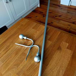 Silver coloured metal curtain pole with tie backs. the paint has a few dinks and scratches but still functioning. The pole measures 160cm which includes the balls. collection from Carshalton on the hill.
