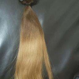100percent human hair clip in hair extension 20inch long never been worn. ombre brown to golden blonde