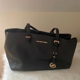Genuine Micheal Kors tote bag. Black barely used. In great condition.