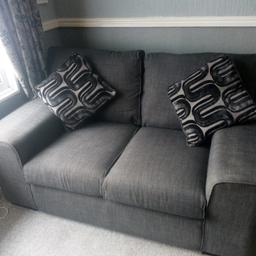 In very good condition
.
Black /Grey
Measure: length 74" width /depth 37".
Well made, easy clean and super comfortable.NO holes, real wear, tears or rips in the fabric
The foam seats haven't lost any shape and fibre filled back cushions are in excellent plump cond.
Always looks tidy. Years left in this lovely sofa.

Two original cushions

All covers removable and washable at 30/40. Dry within 30 mins.
Well looked after.

Space needed
Collection from WS12 Cannock Staffs
Near offer

Thanks