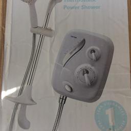 Triton power shower. Brand new never used in packaging. Just box damaged.