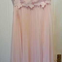 2 Bridesmaid dresses one size 14 and the other Size 10. Bought for £110 each, Brand new never worn. In blush pink, fully lined and with a beautiful cotton lace bodice, with slight off the shoulder straps. The skirt part is pleated. Fastening is a zip at back and hooks. Machine washable. Either buy both for £120 or one for £75.