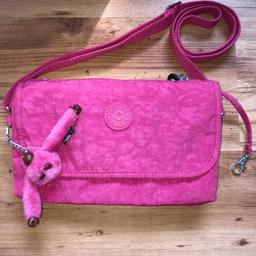 Lovely 100% genuine Kipling handbag in a gorgeous shade of pink. Still has original monkey branded charm. Adjustable shoulder strap. Internal zip pocket. Plenty of room for everyday use. Immaculate condition, hardly used. Lightweight handbag with lovely Kipling branded hardware. I can post.