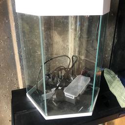 26cm deep 40cm tall 33cm wide 
Hex fish tank , just needs a good clean . 
Comes with built in filter and light ( both untested ) was working fine but been in garage 2 years