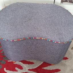 kidney shaped Ottoman ...Ideal for.storing bedding ect has been recovered in grey material the Ottoman is solid theres a small mark and a bit of a water stain but not really noticable  ...very easy to recovery

collection from Hallwood park wa7 2fr