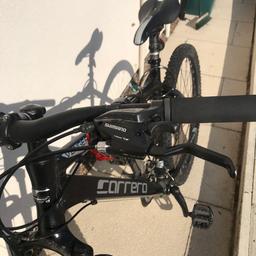Carrera mountain bike 
Black 
Helmet drink holder and bottle 
Excellent condition
