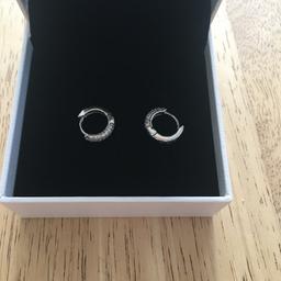 beautiful pandora earrings, as new in box. selling as duplicate birthday gift