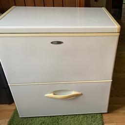 A lovely working chest freezer. 32"wide, 22"deep, 33"High. It has an opening Top section and a pull out draw section . Ideal for having in your kitchen , utility room, garage or shed to keep those extra bits you have bought and can put in this freezer for a rainy day. I have marked it up to sell. There are a few dints in that I have tried to show in the pictures