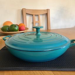 Oval cast iron shallow casserole dish makes cooking easy straight from oven to table. Cast iron cookware spreads heat evenly and retains it longer. Can be used on stove top or oven. 
Casserole dish - 3 litre capacity, 
•Size; L31.1, W38.6, D11.2 cm
•Colour: Teal
•Interior material: cast iron enamel coated
•Exterior material: cast iron enamel coated
.Oven safe up to 260°C
•Suitable for hob types: electric, gas, ceramic, induction, solid hotplates and halogen.

USED IN GOOD CONDITION 
COLLECTION