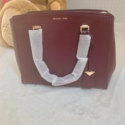 Beautiful oxblood colour with gold detail and detachable long strap. As you can see, the bag has never been used and still has the original wrapping on complete with dust bag. 100% genuine with receipt, purchased from Michael Kors website. 
From clean pet and smoke free home.  
Collection welcome or will post via recorded delivery.