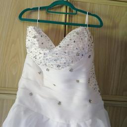 Wedding dress in excellent condition size 14/16 including hoop, if genuinely interested you can come and try on. Also got 2 pairs of wedding shoes price is negotiable if buying dress