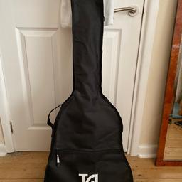 Full sized acoustic guitar, comes with 1 plectrum and  bag with straps on the back