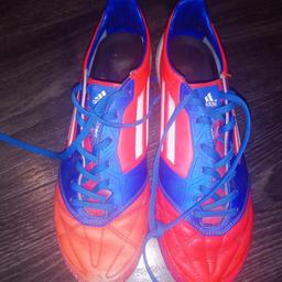 Football boots Adidas orange and blue size 7.
