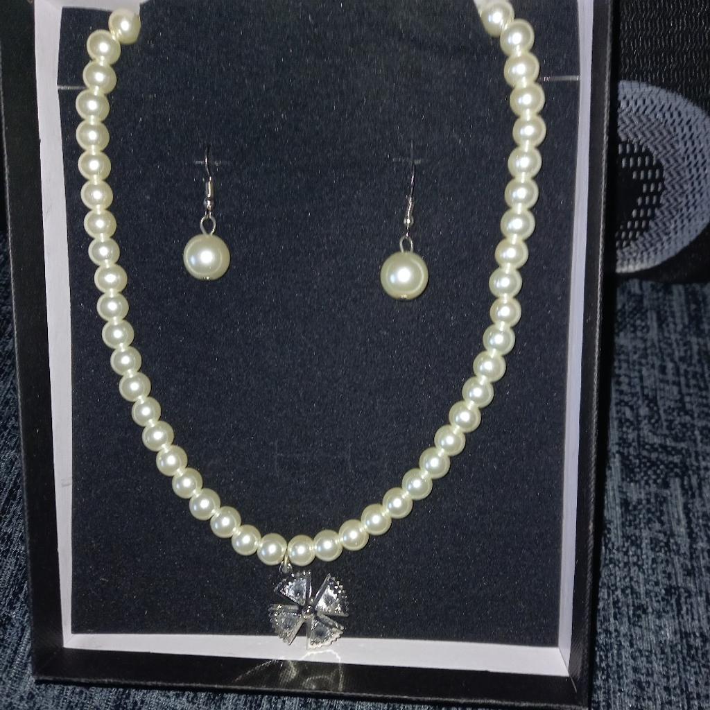 Pearl necklace and earrings for pieced ears comes in a box brand new never been out of box great for a present collection only