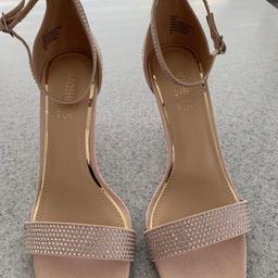 colour is nude with diamanté on heels ,front strap and ankle strap ideal for any occasion 
These are brand new never been worn, size 5 /38  buyer can collect.