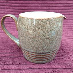 Denby Greystone Ribbed Milk Jug
9cm Tall
Excellent Condition 
No Chips,  Cracks Or Crazing