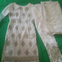It has been used once but still looks brand new.This is size small.It comes with kameez ,scarf and trousers.