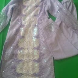 It has been used once but still looks brand new.This is size small.It comes with kameez and trousers.