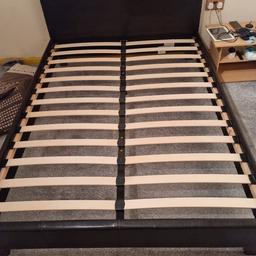 black double bed with slight rip