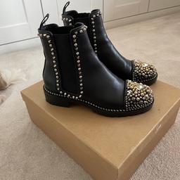 Christian Louboutin Calfskin Studded Chasse A Clou Flat Chelsea Boots 
size 37 (UK 4) 
black 
true to size 
only worn once as I have lots of black boots so very good condition 
amazing detailing, about 1.5” heel and beautiful embellishment 
They will be shipped with Royal Mail fully insured only
comes with box and dust bags
please ask any questions or for additional photos.