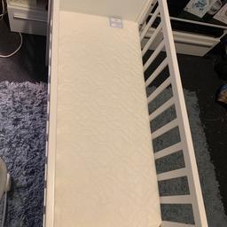 White crib/small cot comes with a brand new mattress my son spent 1 night in it, only selling as we bought a next to me instead