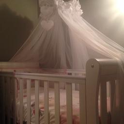 Selling a beautiful drape that attaches to s cot. Please note the cot is not for sale