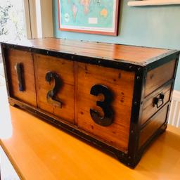 This is a wooden storage trunk with metal fittings. Handles either end and three individual large draws, that are the depth of the trunk.
Each number is the handle to pull the draw open. This would look great in any playroom or kids bedroom. 

Sizes are:
Width 40” or 102cm
Depth 17” or 43cm
Height 18” or 46cm

Collection from ORPINGTON BR68AQ - I can deliver locally for a small additional fee. 
       Comes from pet and smoke free home.