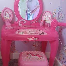 pink dressing table no longer played with, comes with make up and hair dryer, and stall yo sit on 

collection only 
£10