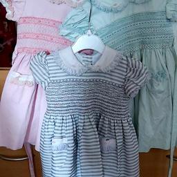 all age 12 months 
mint with pink smocking £25 tiny mark not noticable when worn 

pink with pink an green smock thicker material 
...grey with pink smock 35 each 
both in good condition