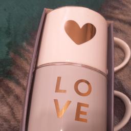Stackable Mugs one gold heart and the other one say Love.onit . one is pink the other one is grey collection only No time wasters thank.