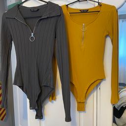 2x bodysuits size 6 from select 
1x grey 
1x mustard 
Collection only chelmsley wood