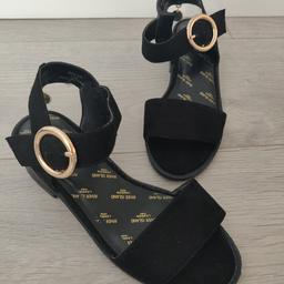 Brand New River island sandals size 1. Gold buckle fastening and gold charm on rear. Small heel. Grown out of before worn. From a smoke free and pet free home. Collection Wallasey CH45 or will post for additional cost. PayPal accepted