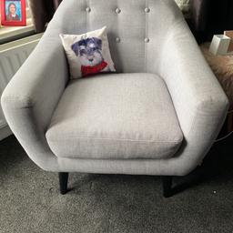 Light grey button back armchair from Dwell. Originally £300 in very good condition. Dark wood legs. Size approximately 85cm deep x 70cm wide.