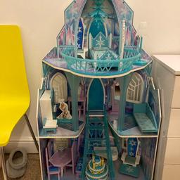 This is a wooden frozen castle not the cheap plastic one. It comes with all the furniture pictured. Some furniture has scuff marks on abs one side table has a pen mark. The piano has the legs missing but can rest it on the little tables as we have done. Still plenty of life left in it to make other children happy. It is quite big as you can see from the comparison to the chair next to it in the picture. Collection only.
