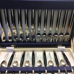 This 24 piece cutlery set comprises 6 knives 6 forks 6 spoons and 6 teaspoons. The cutlery has an attractive feature. The stainless steel metal extends up the handles on one side. The cutlery is marked Eldan stainless steel. As new condition and never used.