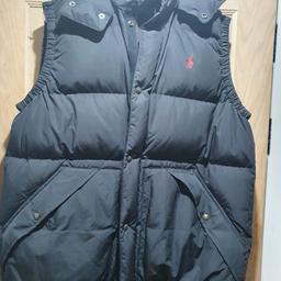 This is a genuine Polo Ralph Lauren puffer gilet body warmer in size XL
worn only once, so this is like new - only selling due to weight loss 
water repellent down feather
This originally cost £305.00  & selling for £120
You don't see many with the hood, this is an absolute bargain 
ideal Xmas present for someone 
All buttons have the logo on them & black in colour
you can see the quality when you collect & collection from post code B68