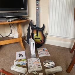 Nintendo Wii for sale. 2 controllers and guitar hero guitar and game, wii sports, games party  and wii play games. Good condition. From a smoke and pet free home. Collection from Lichfield.