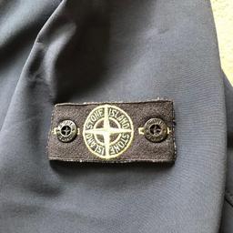 Stone island junior shell jacket
Age 14 164cm- Navy.
Genuine!!! Good condition but has been worn loads, he loves this jacket.
Wear to the edging of the hood, although not really noticeable when on, tried to show in pics.
Collection only BR7  NO POSTING SORRY