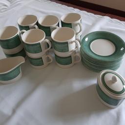 Tesco home shop "Bramley" Cream and Green 26 pieces tea set. 12 cups, 12 Saucers, sugar bowl with lid, milk jug. Approximate diameter: Saucers 15cm, cup's 8cm height 6.5cm. 