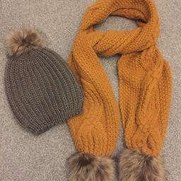 Brand new Boutique khaki chunky knit faux fur Pom Pom hat 
Mustard cable knit faux fur Pom Pom scarf by George, worn once and in fab condition ~ Collection from Birkenshaw, BD11 or happy to post 🍁