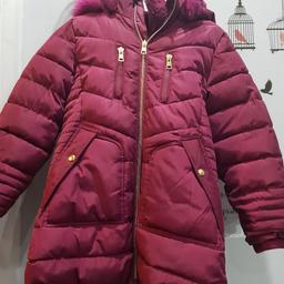 girls winter warm coat age 6-7 years. burgundary in color. very warm and cosy. hardly used once.