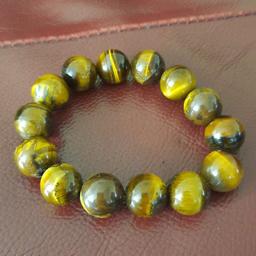 Genuine Tigers eye bead bracelet. Bought in Thailand
size adult.
picure doesnt do it justice