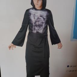 BLACK TUNIC WITH HOOD AND BELT. HAS A SKELETON RIBS IN THE CHEST