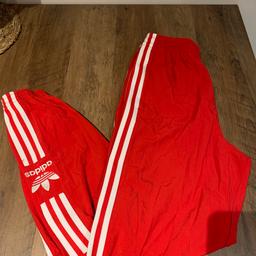 Adidas Originals adicolor locked up logo track pants in Red UK 6 XS new with tags

Brand new, unworn trackies in mint condition